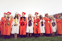 clapping high school graduates 