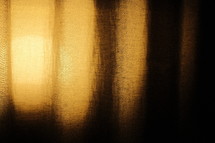 light shining on a curtain 