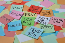 colorful pile of notepads with new year's resolutions for christian life 
