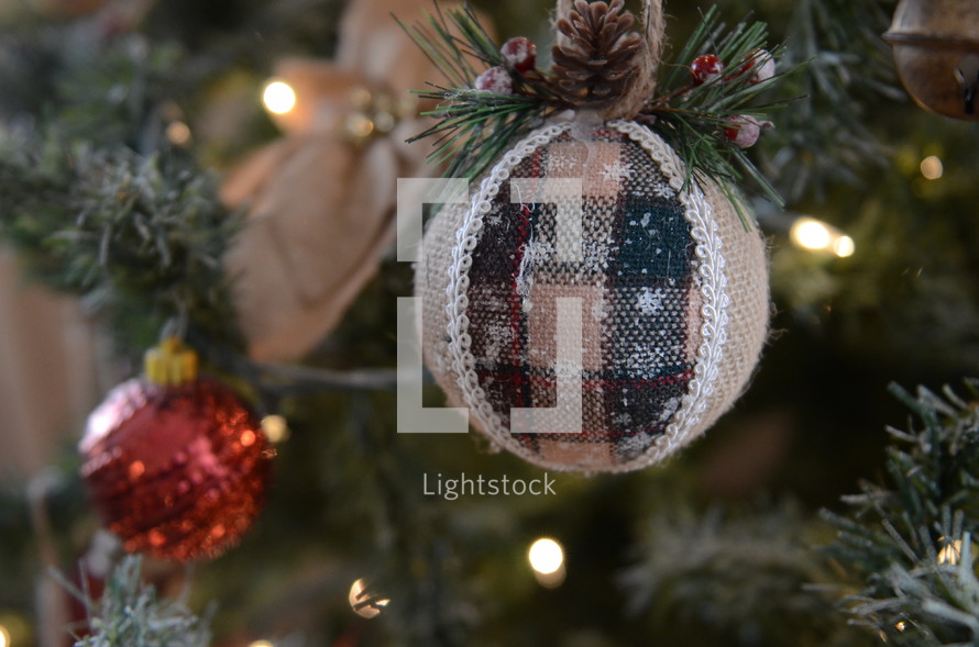 burlap and plaid ornament on a Christmas tree 