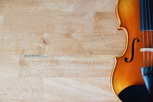 a violin on a wood floor 