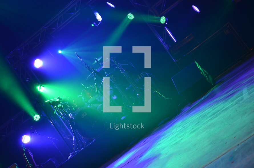 stage lights over a drum set