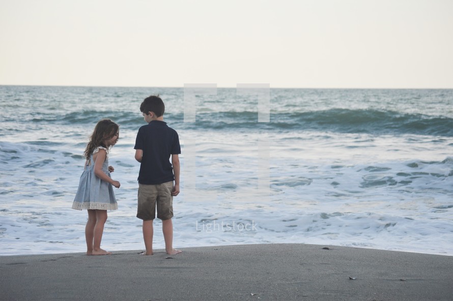 siblings on a beach 