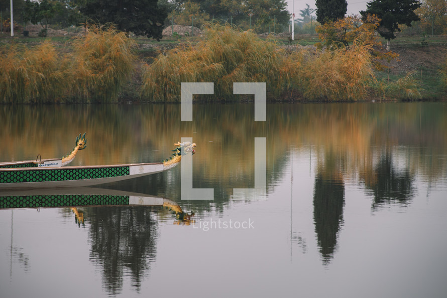 Boats and autumn colors in the lake