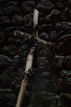 a cross of sticks on stones 