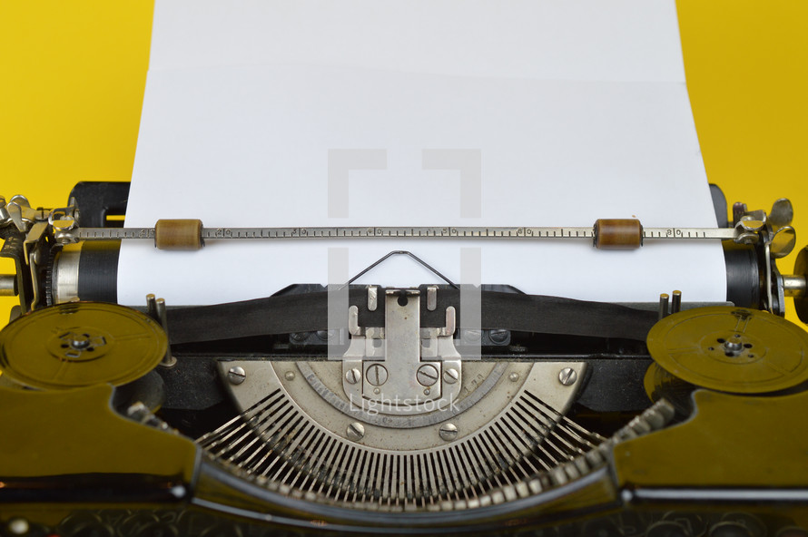 typewriter with blank paper 
