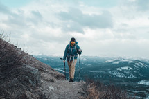 a man hiking up a mountain 