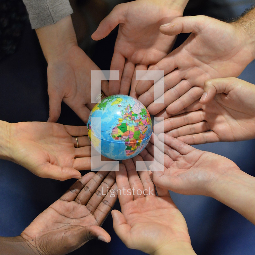 ínternational group holding a globe together. 