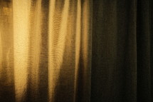 light shining on a curtain 