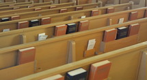 Bibles and hymnals in the back of pews 