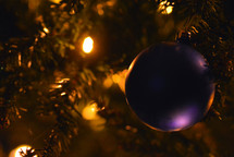 purple ball ornament on a Christmas tree 