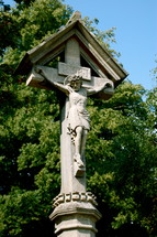 Stone crucifix statue