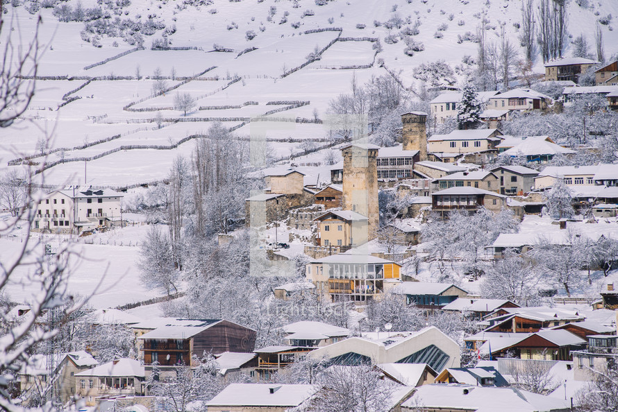 Snowy stone buildings in the village
