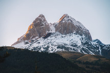 The snowy peak at the sunset