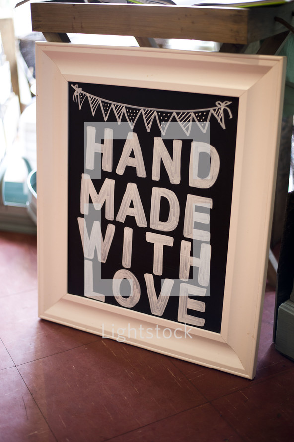 Sign reading "hand made with love."