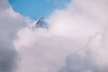Snowy peak shrouded in clouds