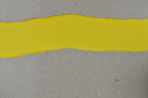 yellow under gray torn paper - ripped paper revealing yellow blank space for words