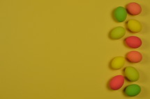 Easter eggs on yellow background 