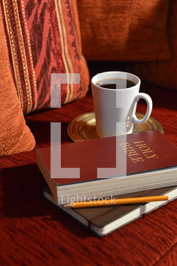 coffee, Bible, and journal on a couch - comfortable bible study at home 