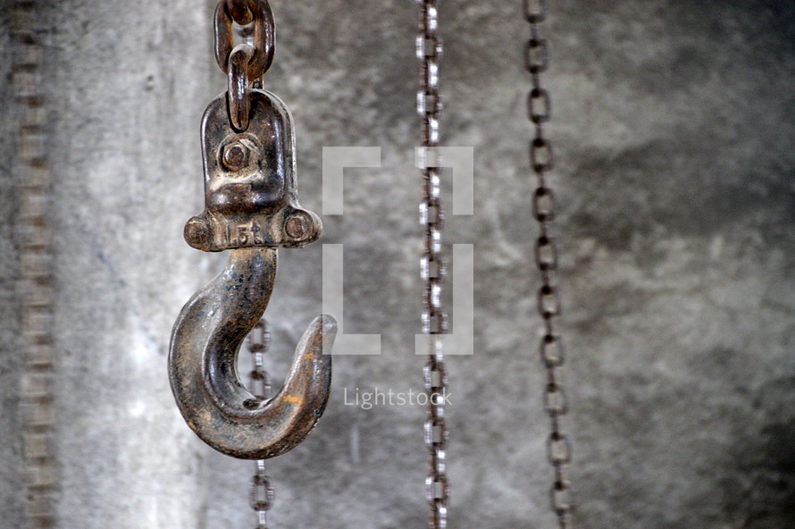 hook with chains in an industrial building, 
hook, chains, chain, industrial, hoist, hang, building, hang up, caught, snag, lock, raise, raising, pull, pulling, up, down, hike up, hoisting, lift, lifting, wind, winding, bound, trussed, tied, metal, ferric, iron