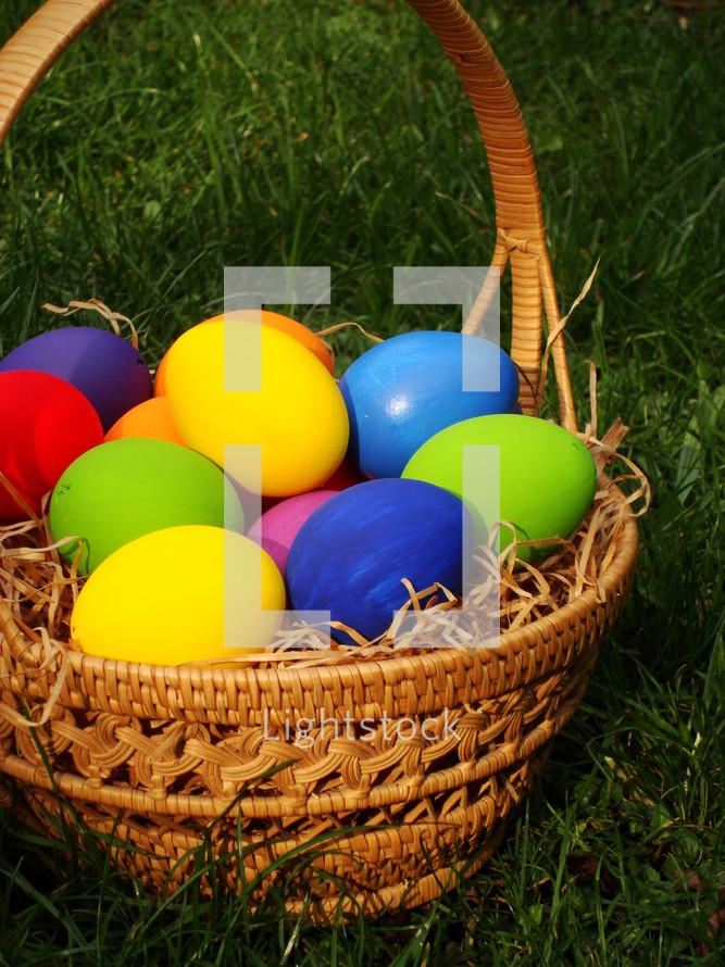 multicolored eggs in a basket
