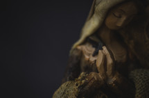 a praying figurine of Mary 
