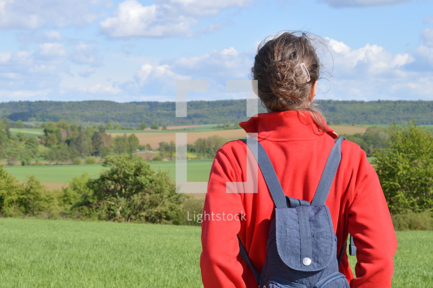 woman looking out at a field 