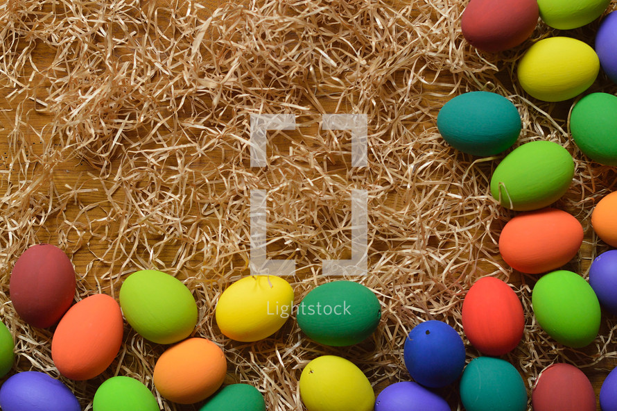 border of easter eggs in straw 