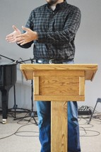 pastor preaching from a pulpit 