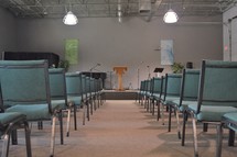 empty rows of seats in a church 