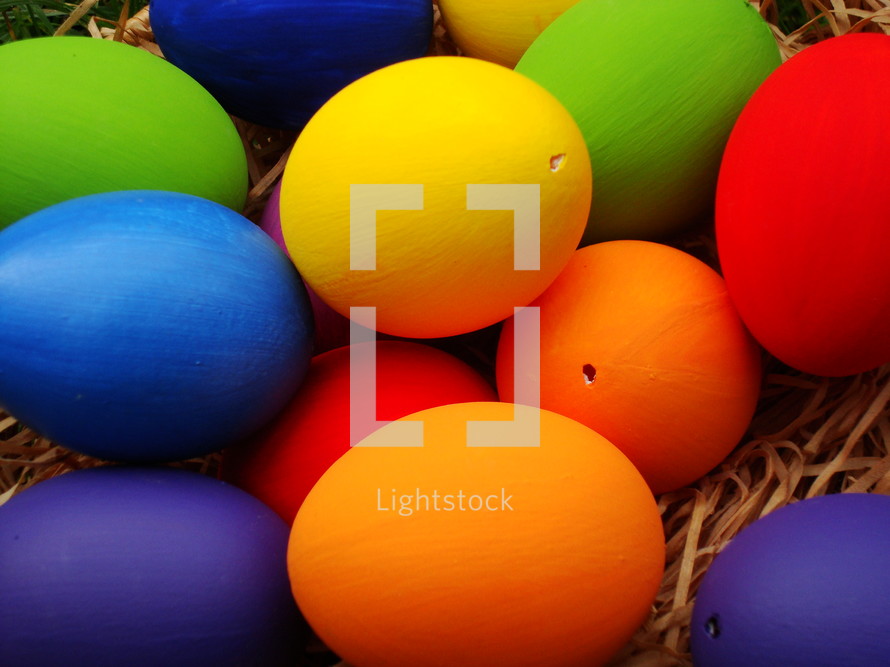 Multicolored Easter eggs in a basket. 
