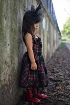 a little girl outdoors dressed up 