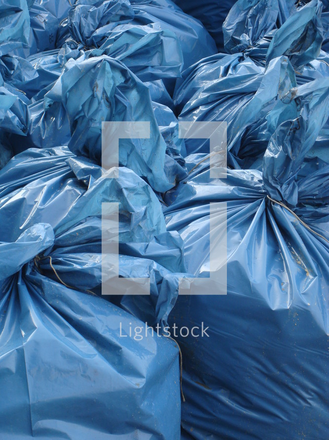 close-up of blue garbage bags