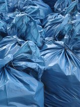 close-up of blue garbage bags