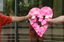 sticky notes in the shape of a heart 