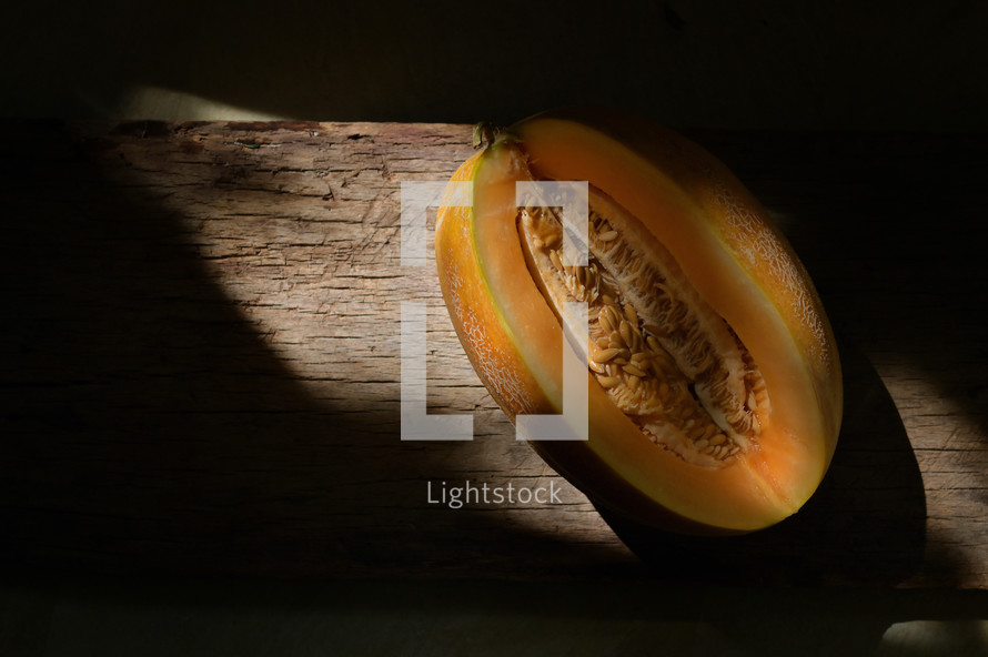 Details of cantaloupe melon, sunrays and shadows