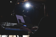 a man playing a digital piano 