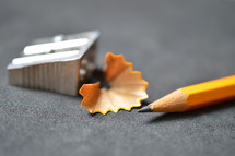 pencil shavings, pencil sharpener, and pencil 