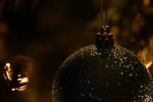 ball ornament hanging on a Christmas tree 