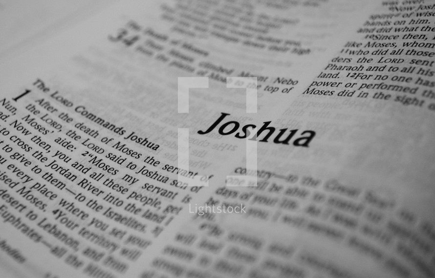 A Bible opened to the book of Joshua.