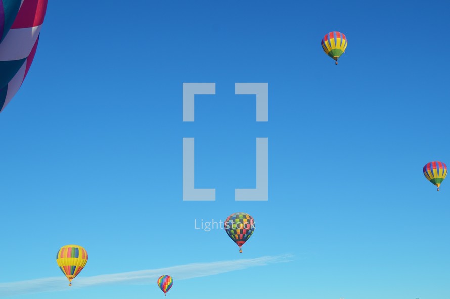  hot air balloons against blue sky 