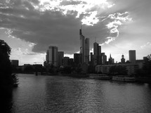 river and city buildings in black and white 