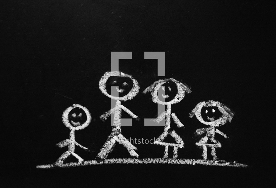 A chalk drawing of a stick figure family.