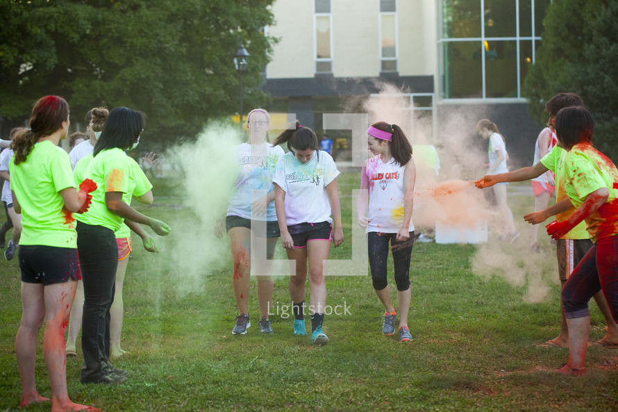 teens running in a color run 