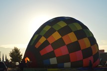 inflating a hot air balloon on the ground 