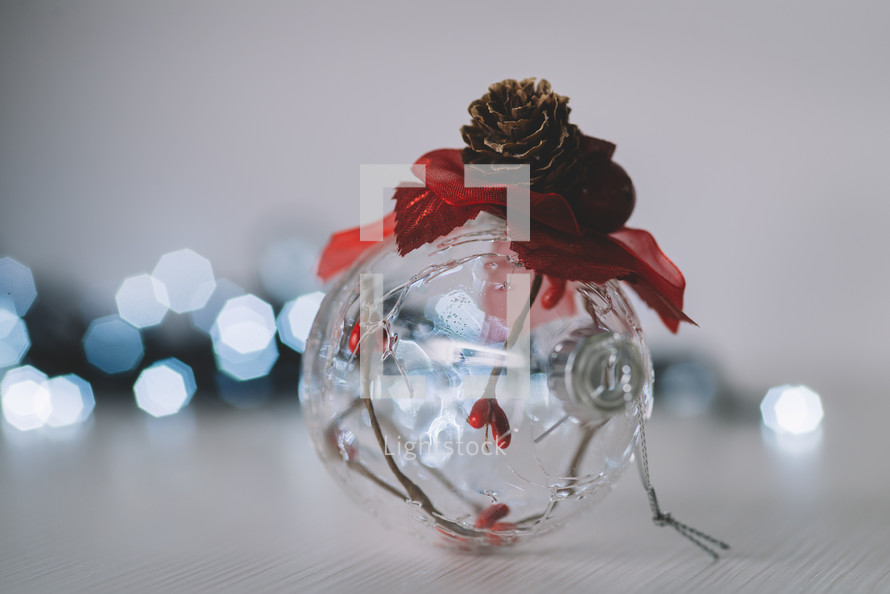 Transparent Christmas toy with a pinecone