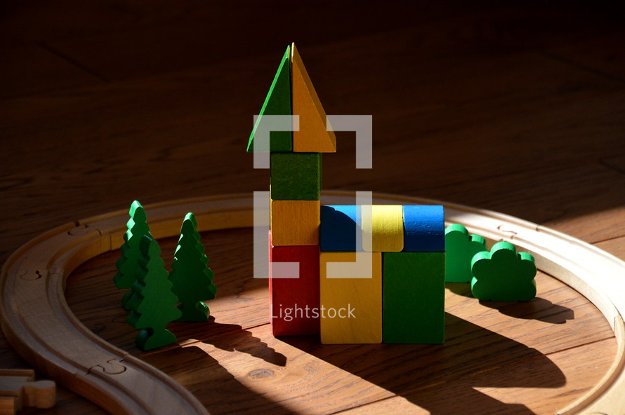 colorful church building made out of wooden toy blocks, 
church, building, children, construct, structure, sunday school, children's church, put up, erect, base on, toy, toys, build, child, kid, kids, toy blocks, blocks, bricks, building bricks, color, colorful, make, made, making, play, playing, learn, learning, together, grow, growing, growth, green, blue, red, yellow, multicolored, painted, part, parts, compound, compounded, assembled, consisting, complex, combined, pieced, piece, pieces, community, wood, wooden, shadow, light, sunlit, sunlight