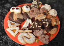 plate with different christmas cookies to share with friends and family. 
