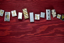 many little presents building a garland on red wooden background