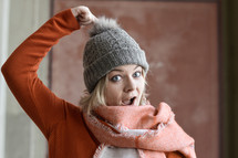 a woman in a knit hat and scarf 